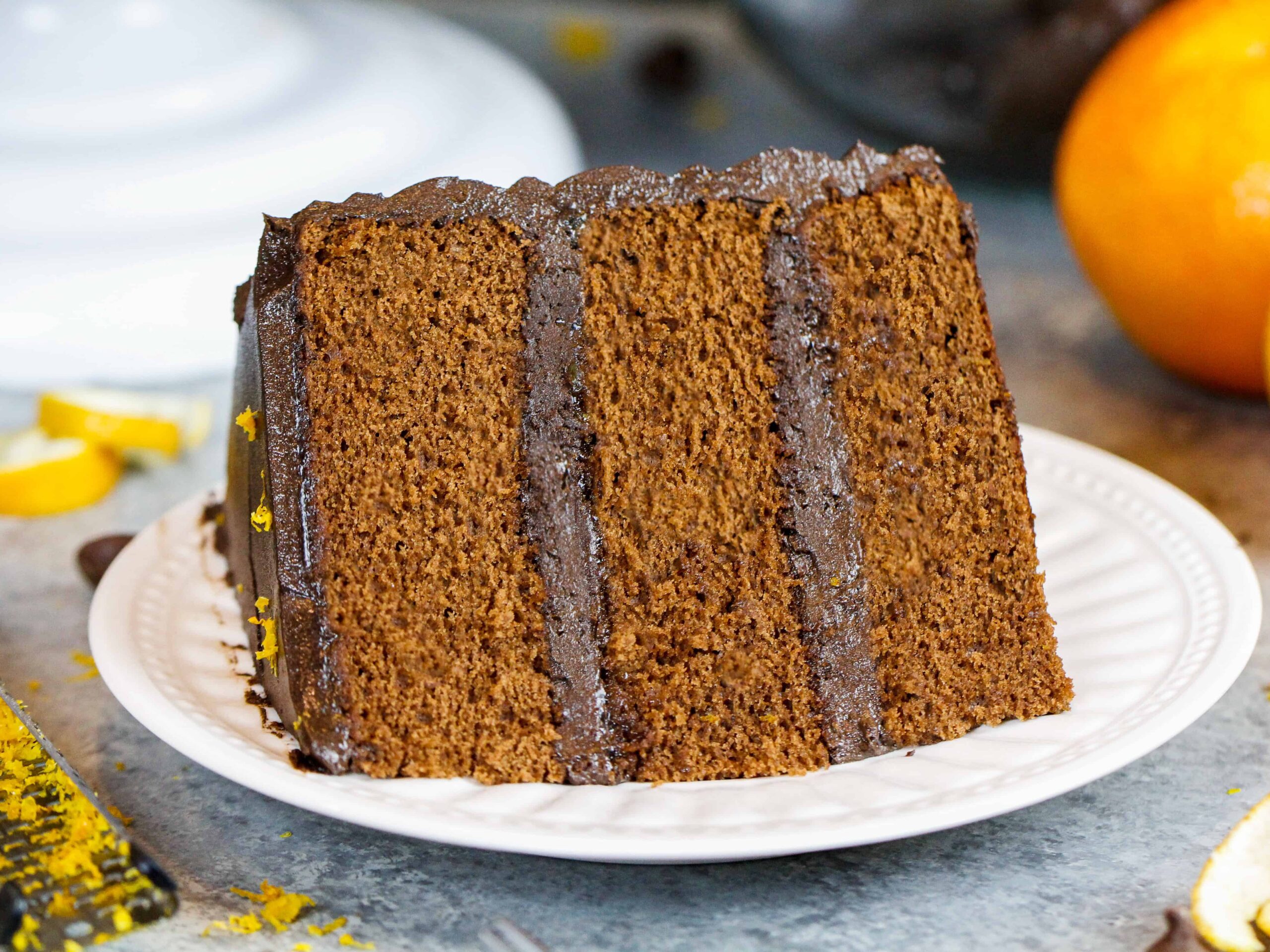 image of a plated slice of orange chocolate cake