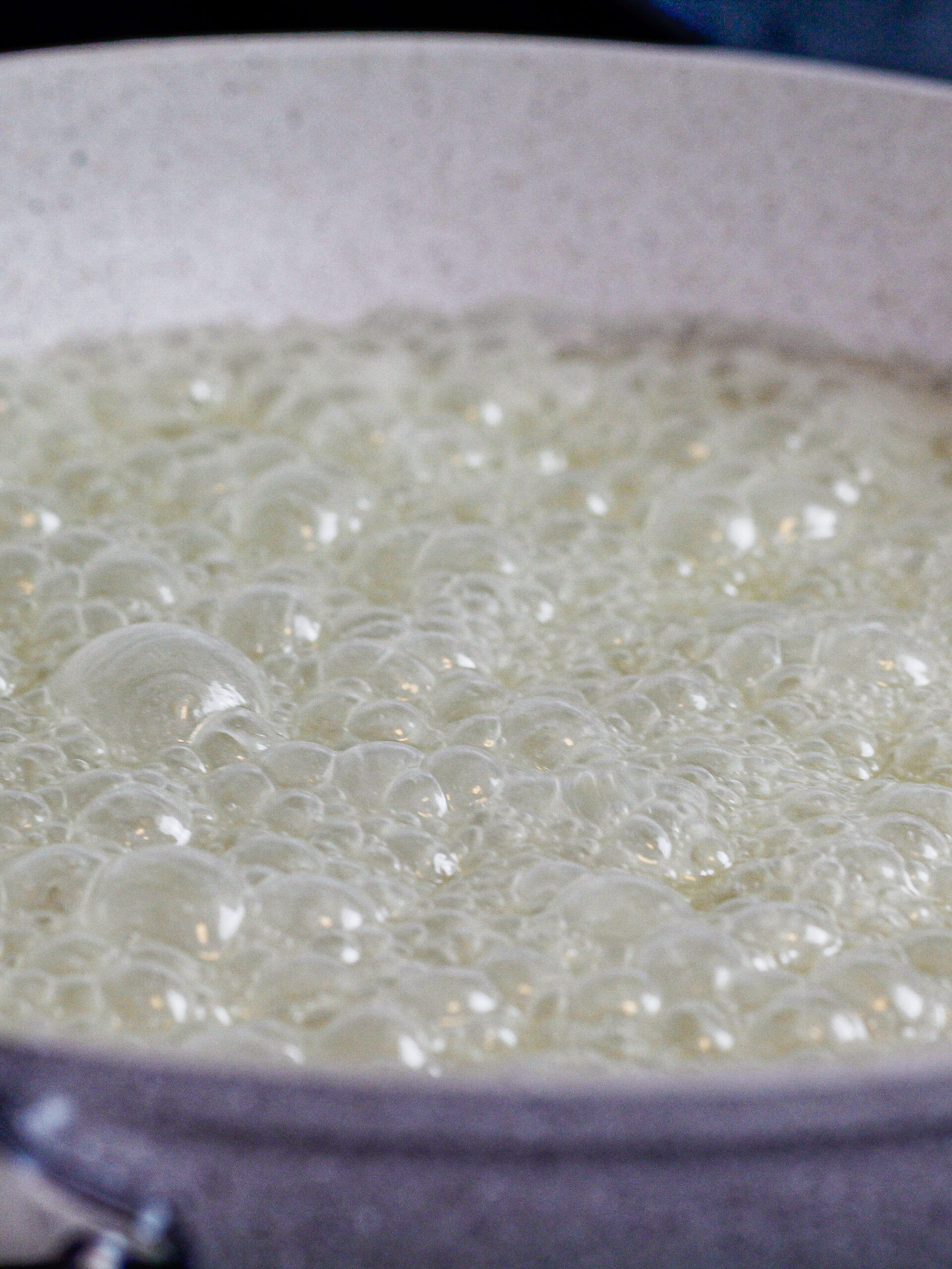 image of sugar and milk being cooked down in a pan