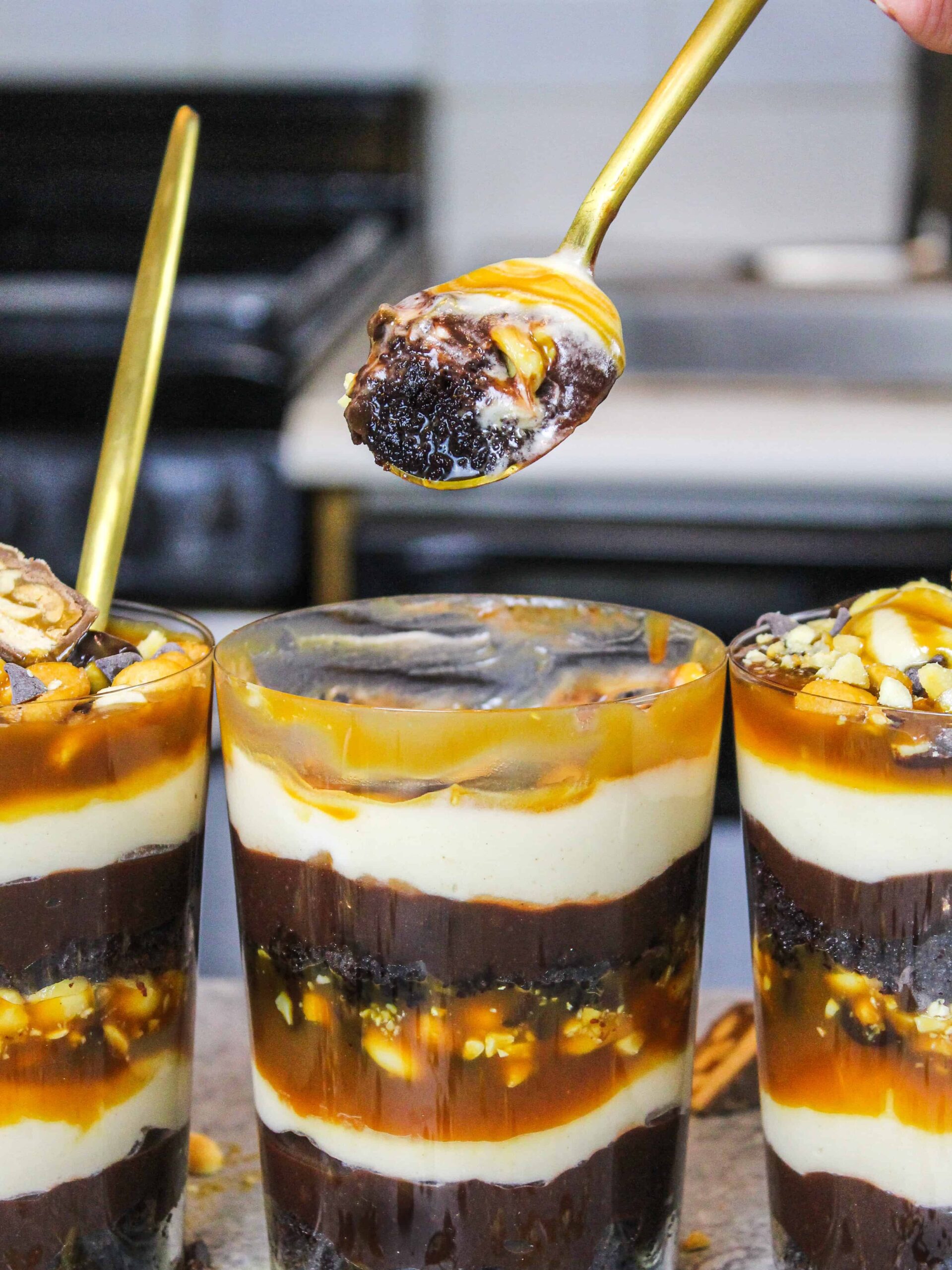 image of snickers trifle with a spoonful lifted to show how delicious it is