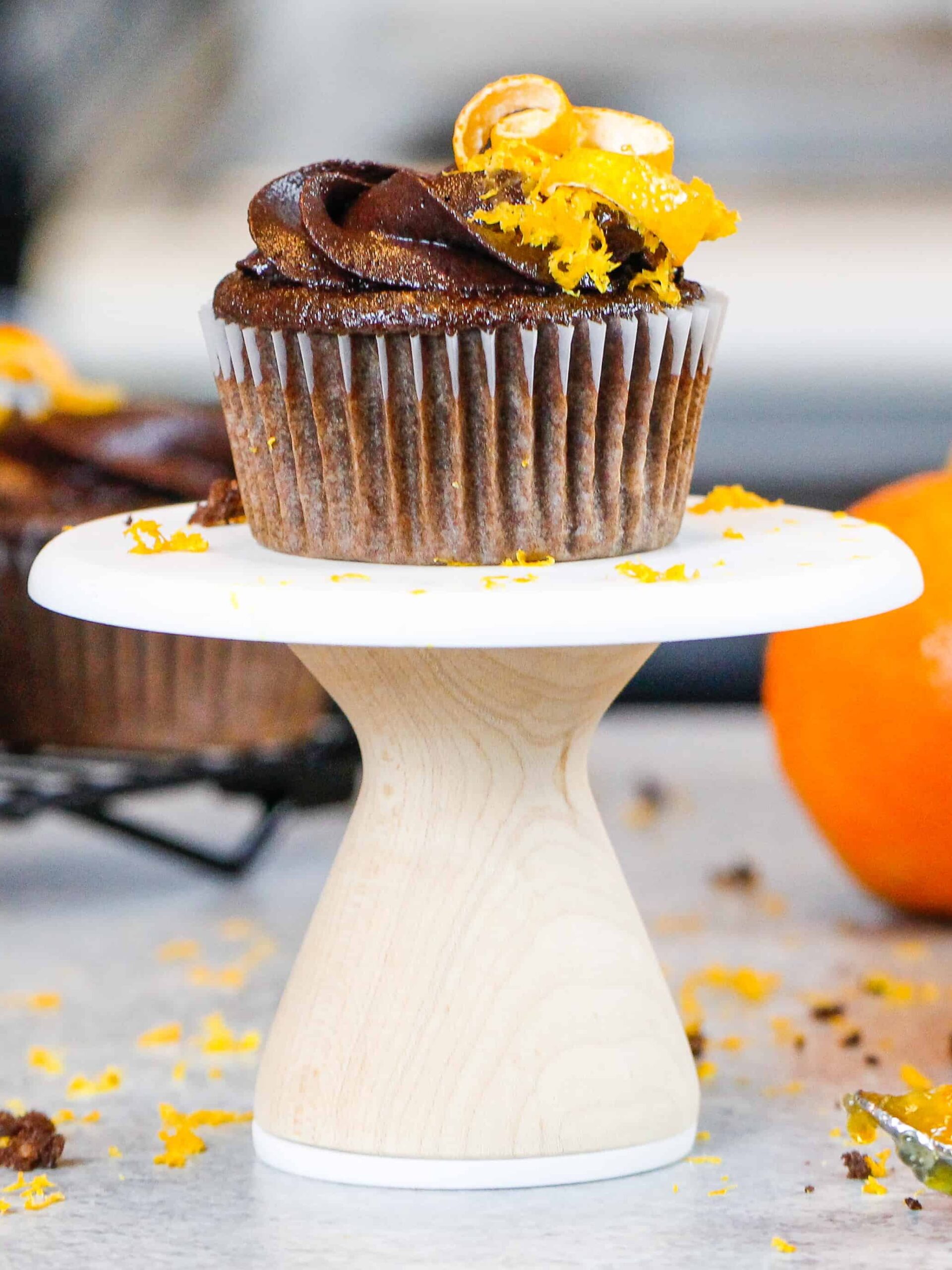 image of a chocolate orange cupcake decorated with chocolate orange buttercream frosting