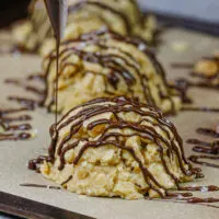 image of gluten free no bake cookies being drizzled with dark chocolate