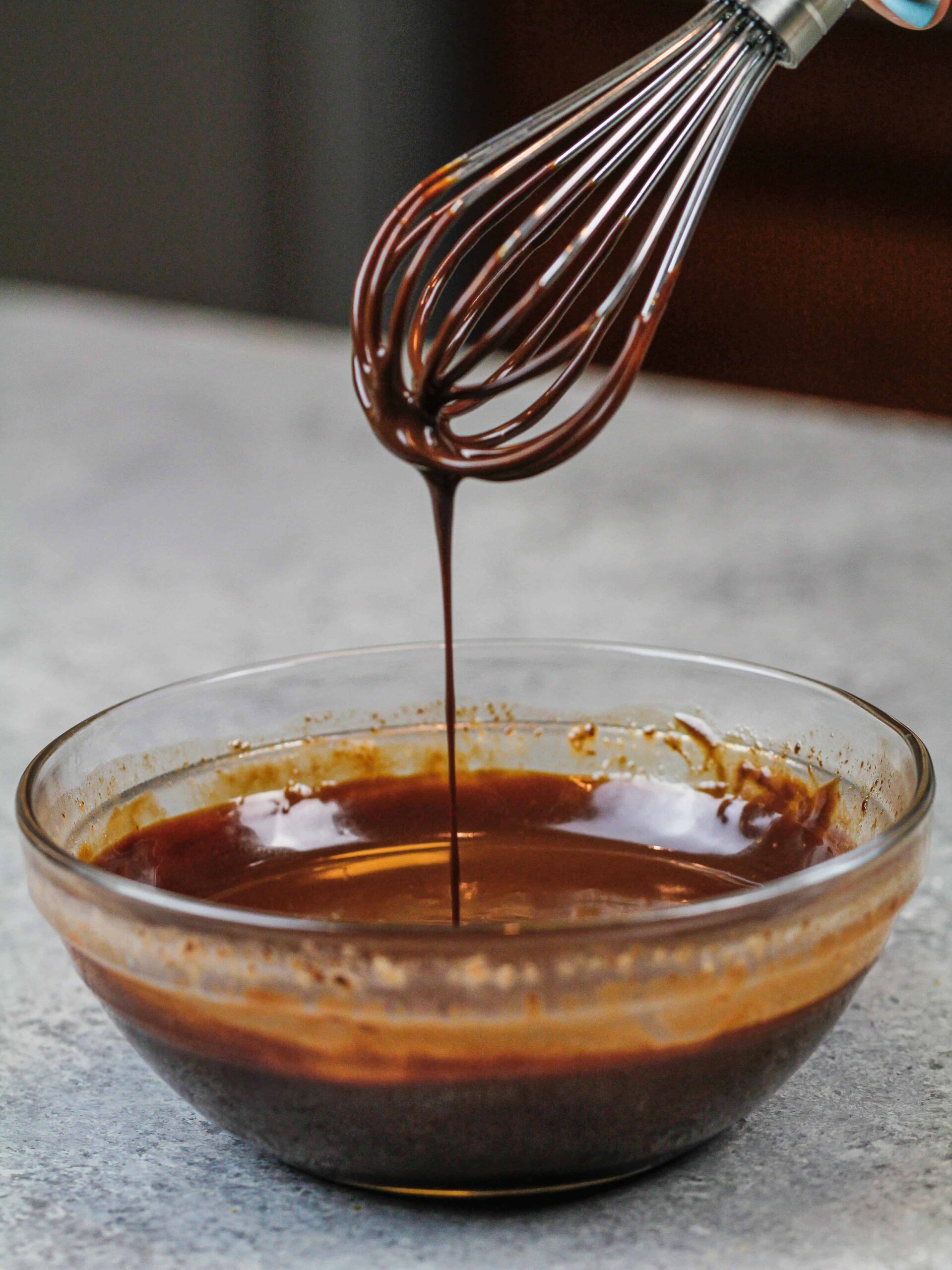 image of chocolate ganache ready to be swirled into marble cake layers