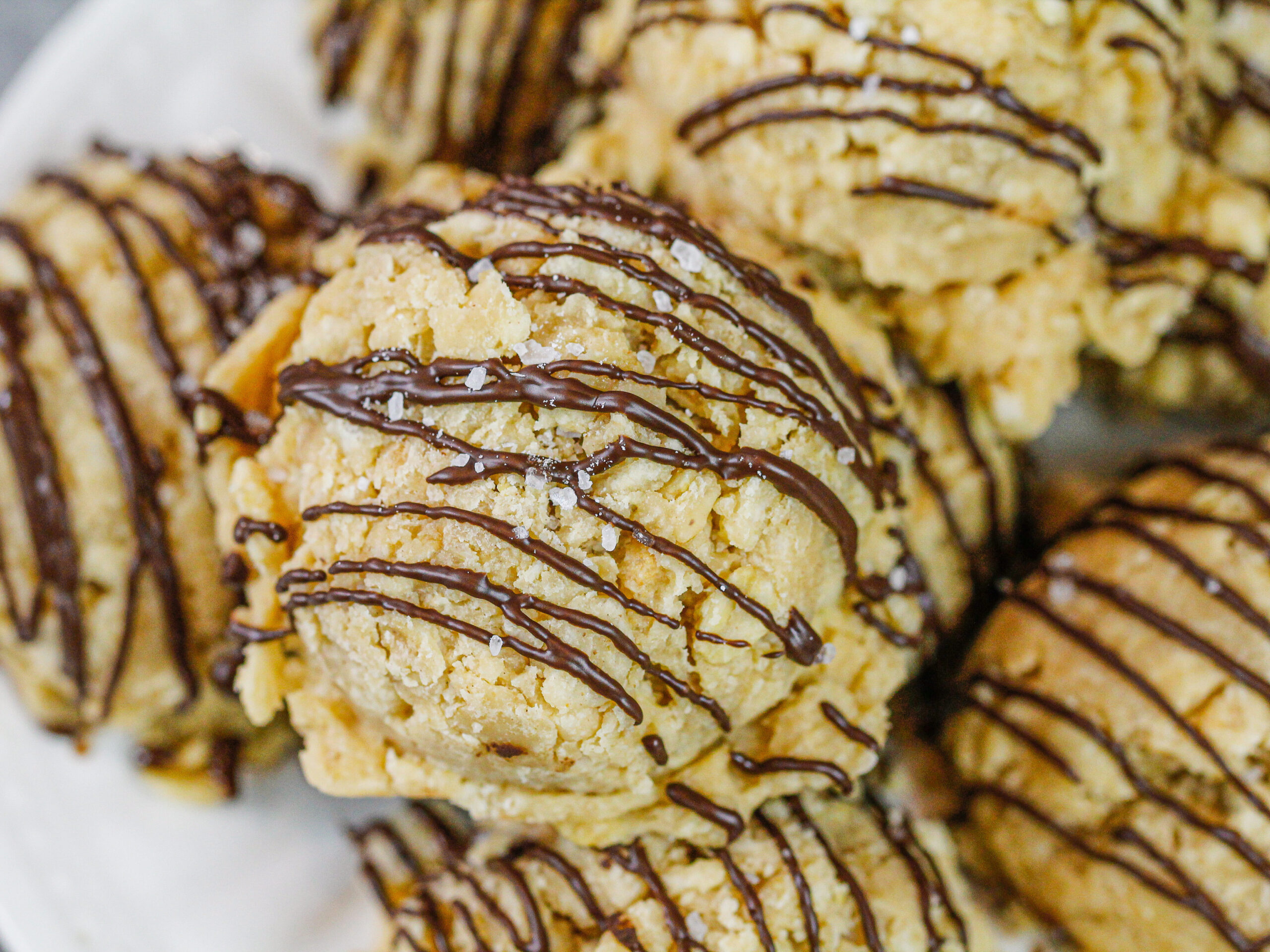 image of gluten free no bake cookies made with peanut butter and rice krispies stacked on a plate