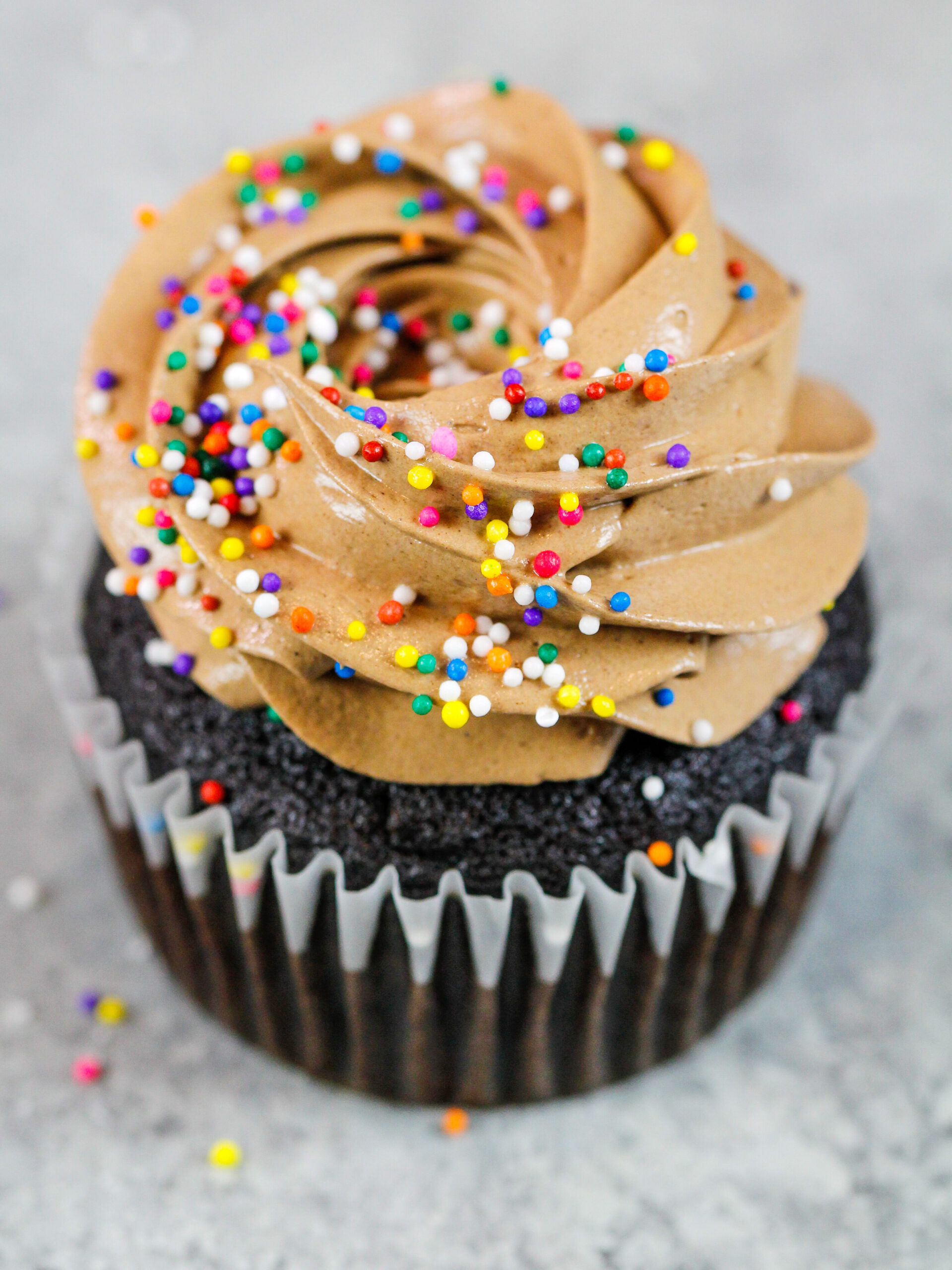 image of a chocolate cupcake frosted with delicious chocolate Italian meringue buttercream