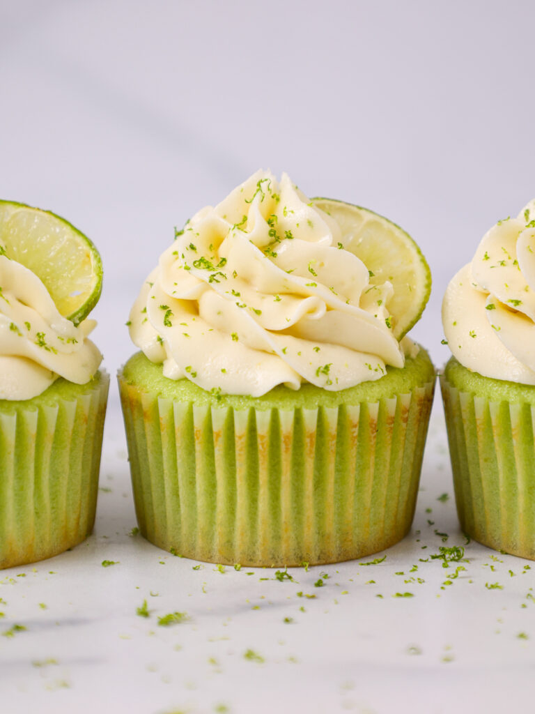 image of lime cupcakes that've been decorated with delicious lime buttercream and filled with homemade lime curd