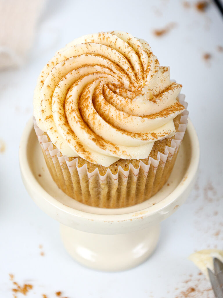 image of a spice cupcake that's been frosted with cream cheese buttercream frosting