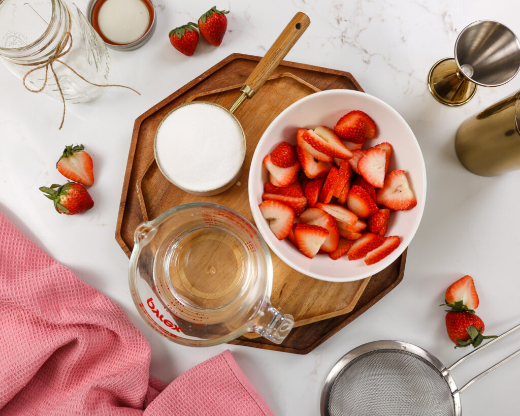 image of ingredients laid out to make strawberry simple syrup