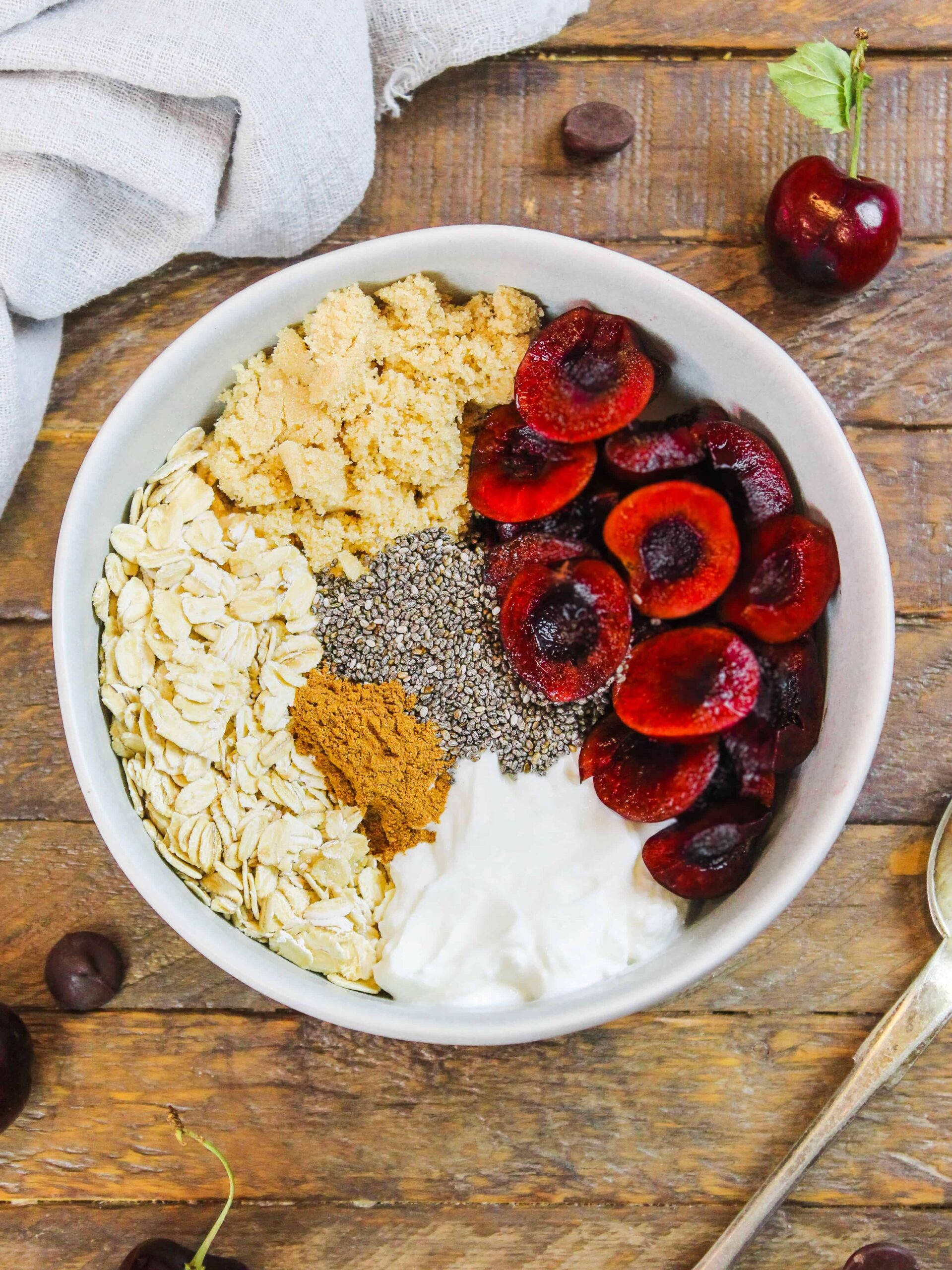 image of ingredients in a bowl to make cherry pie overnight oats