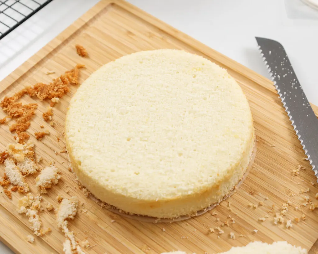 image of a fluffy white cake layer that's been leveled and is ready to be stacked