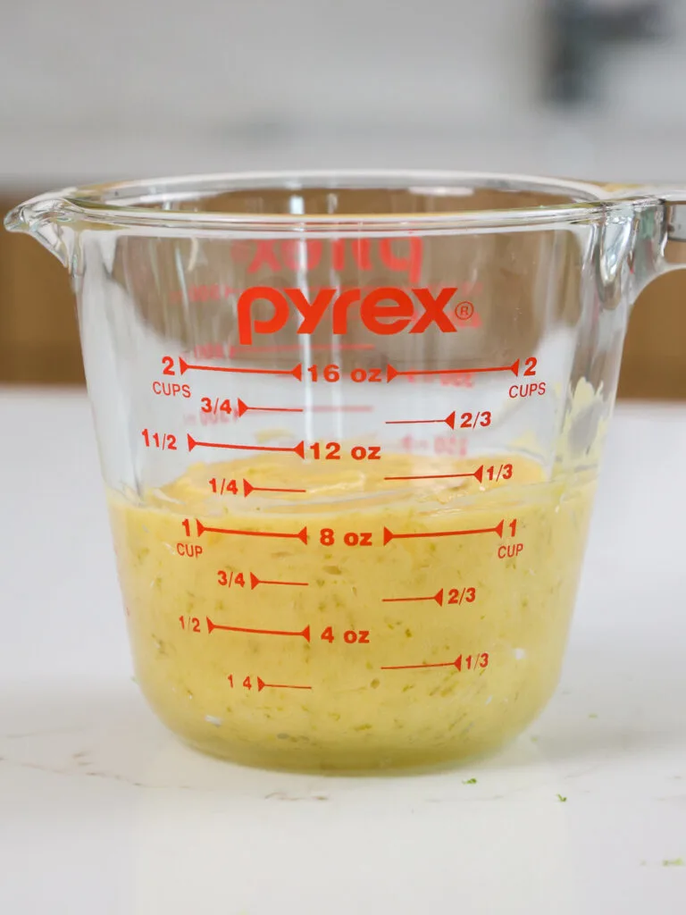 image of lime curd in a pyrex mixing bowl to show that the yield is 1 cup