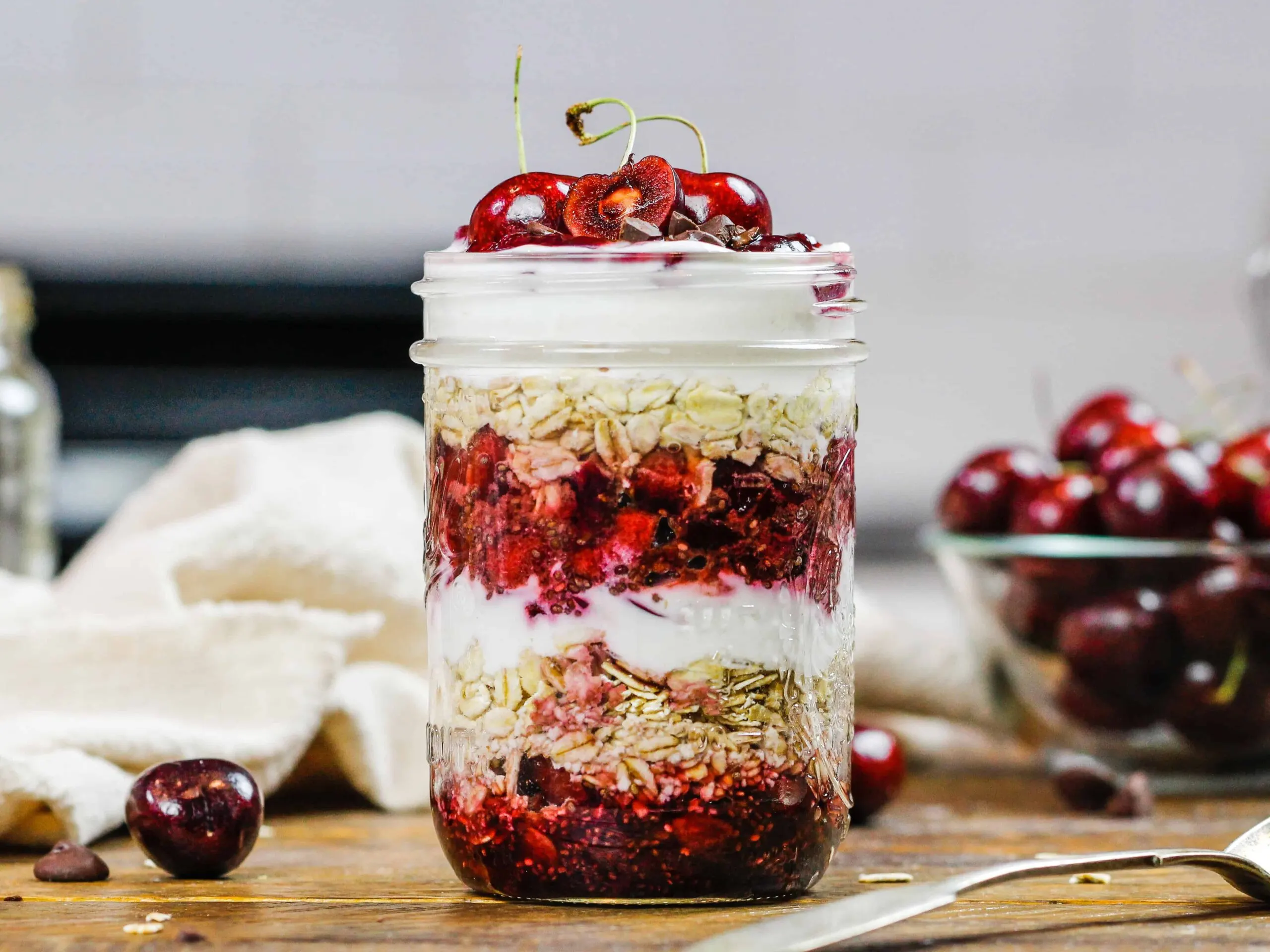 image of overnight oats with cherries in a mason jar
