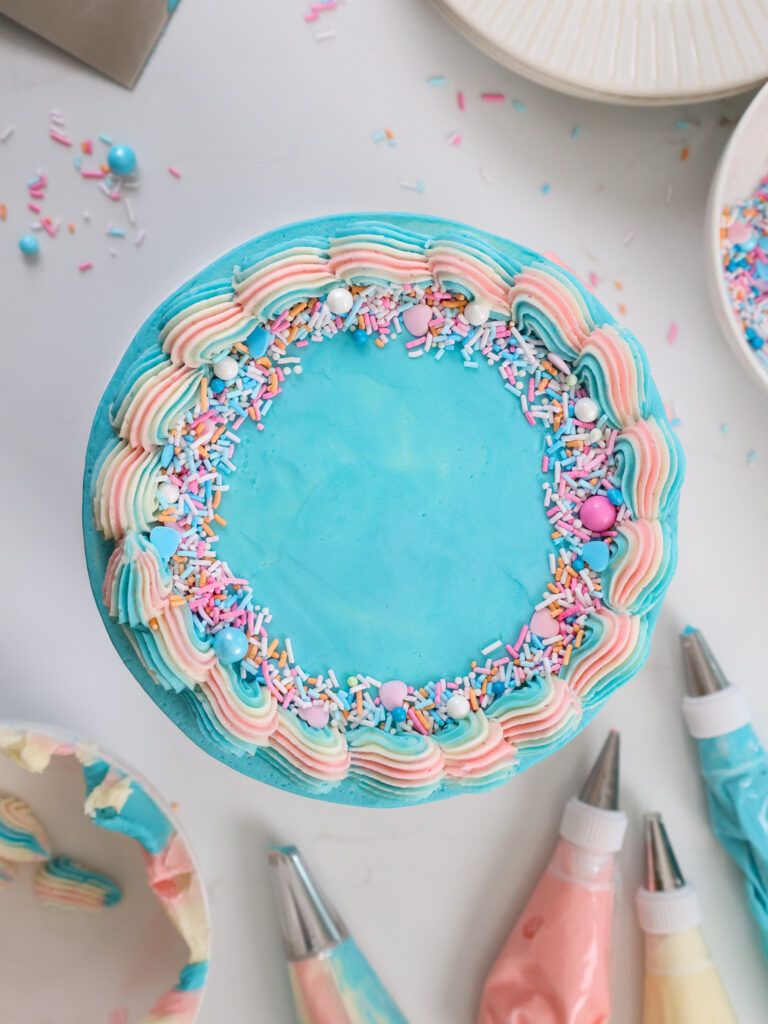 image of a blue and pink cake from an overhead angle