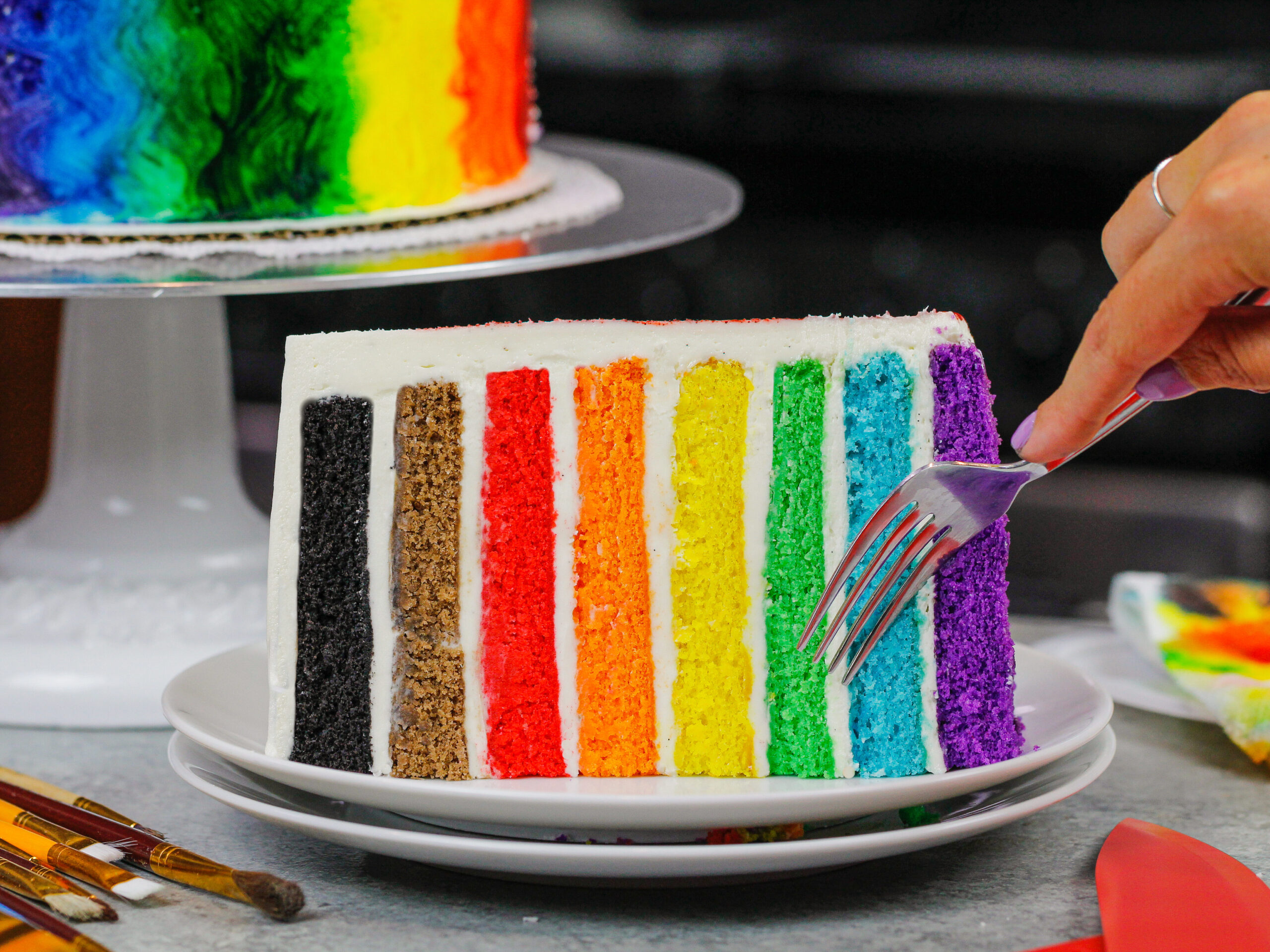 image of rainbow pride cake based on the updated LGBTQ rainbow flag which includes the colors brown and black for inclusivity
