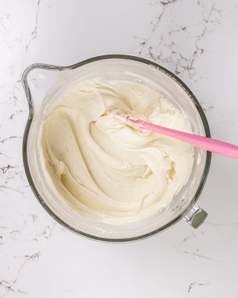 image of vanilla buttercream being mixed that's smooth