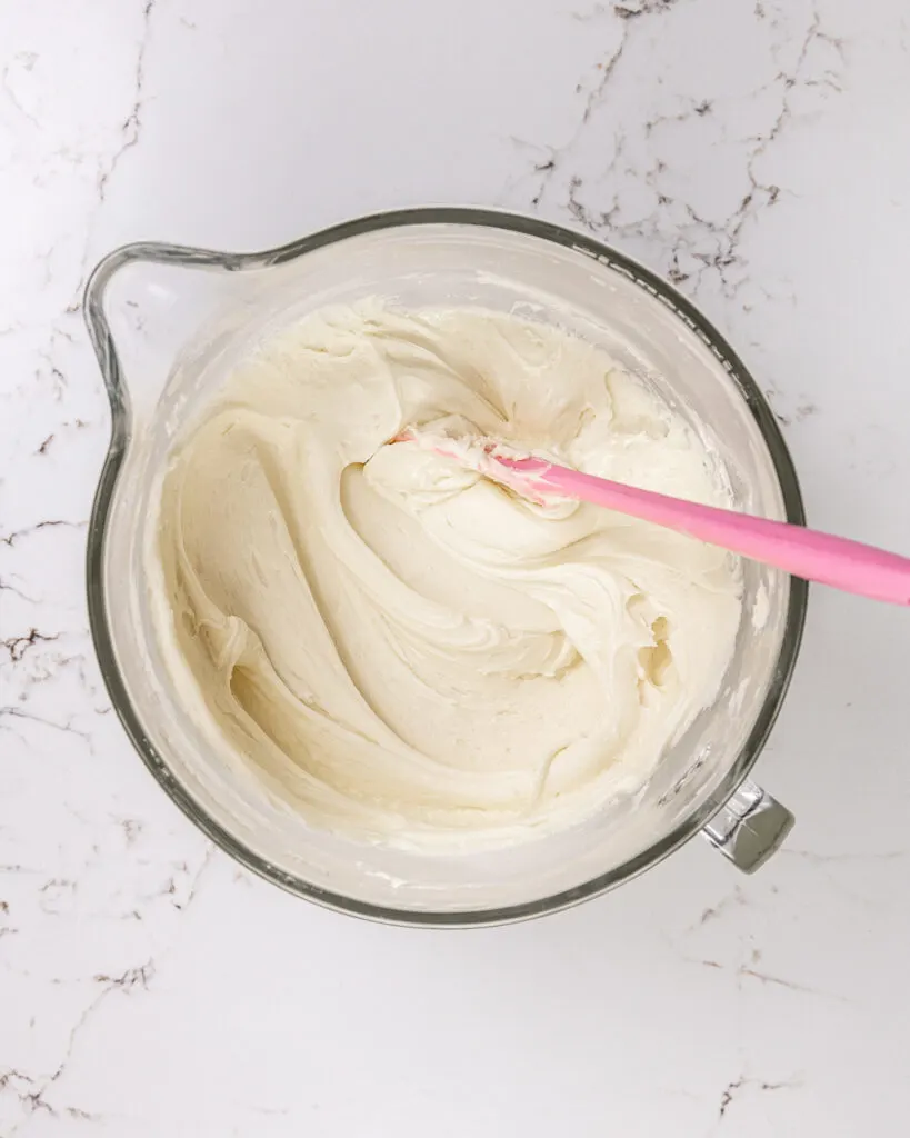 image of almond buttercream being mixed that's smooth