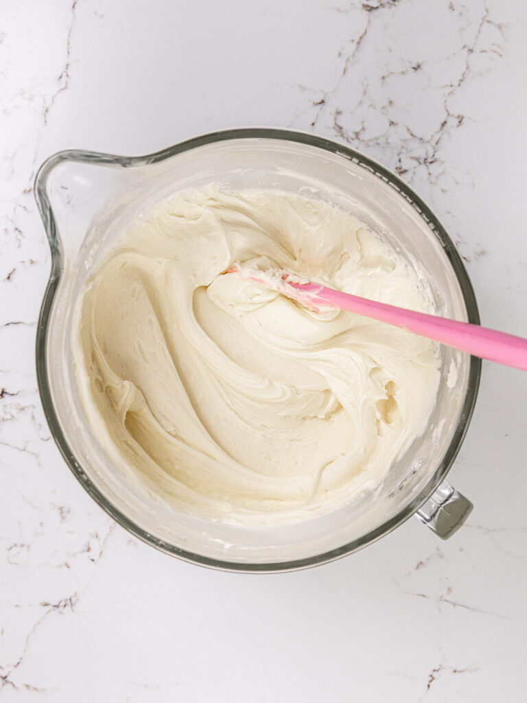 image of cream cheese buttercream being mixed that's smooth