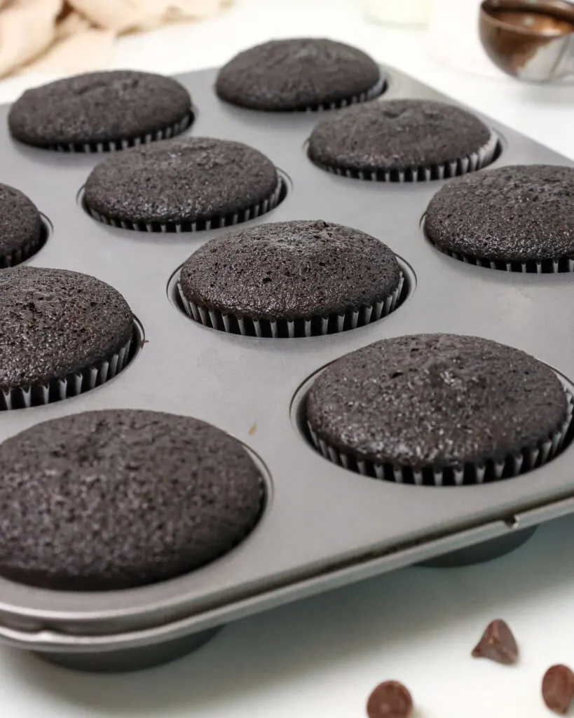 image of baked black velvet cupcakes in a pan