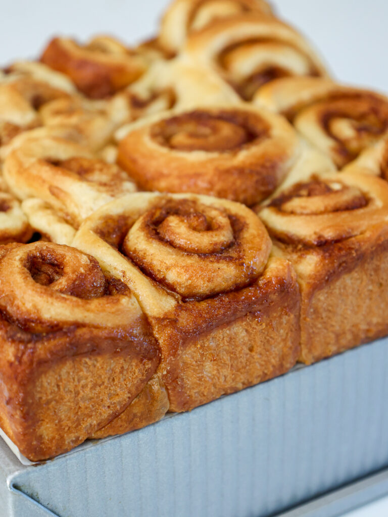 image of mini cinnamon rolls that have been baked until golden brown and are cooling