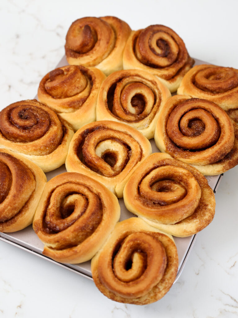 image of mini cinnamon rolls that have been baked until golden brown and are cooling