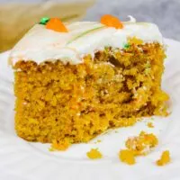 image of a slice of moist carrot cake sheet cake on a plate.