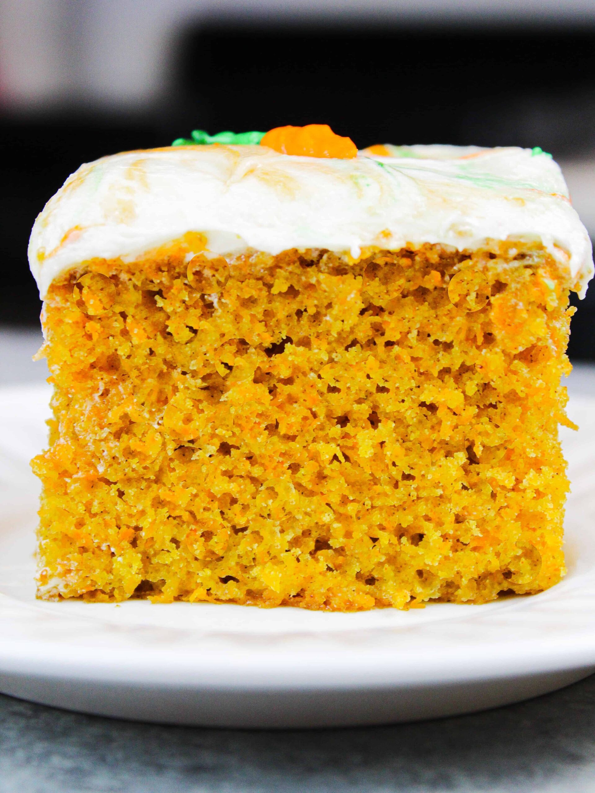 image of a slice of carrot cake sheet cake on a plate