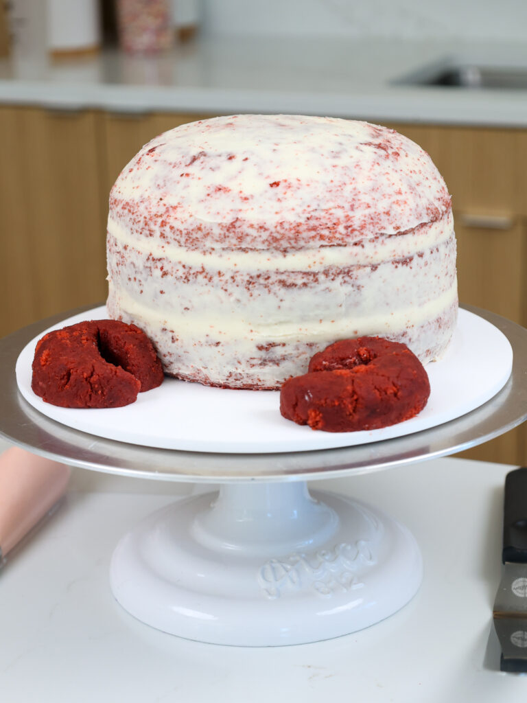 image of a crumb coated red velvet cake 