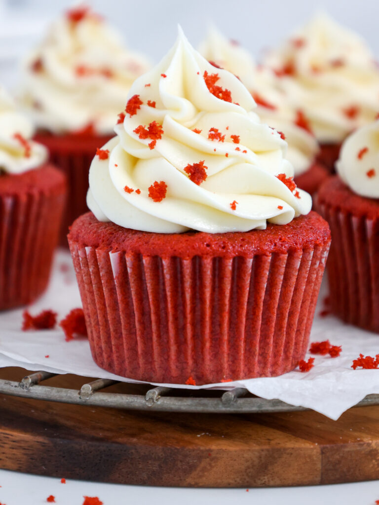 image of a red velvet cupcake recipe that's made with buttermilk and topped with cream cheese frosting