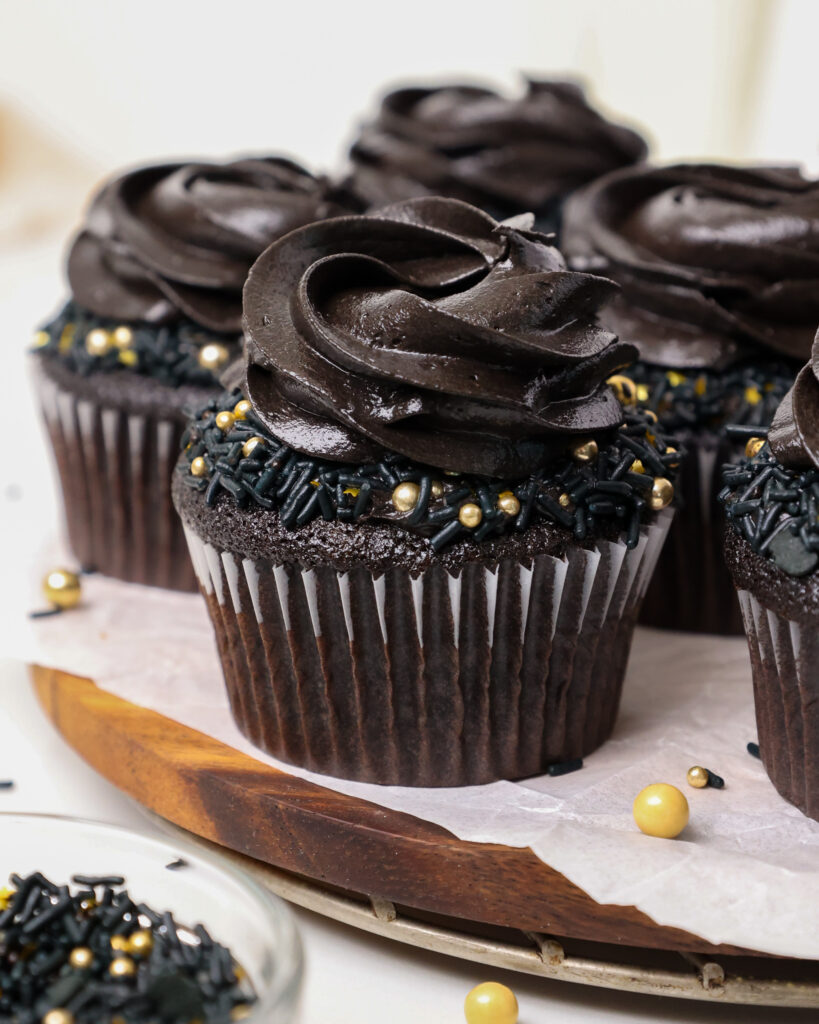 image of a black velvet cupcake that's been frosted with black cocoa buttercream