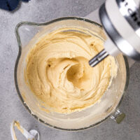image of creamy peanut butter butter buttercream in the bowl of a kitchenaid stand mixer