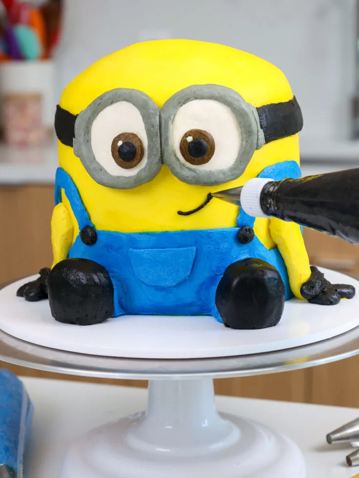 image of a buttercream minions cake made with buttercream frosting