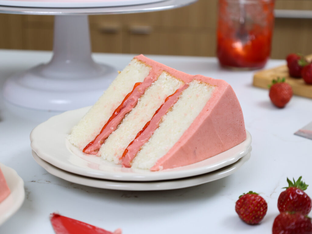 image of a slice of strawberry mousse cake that's been placed on a plate