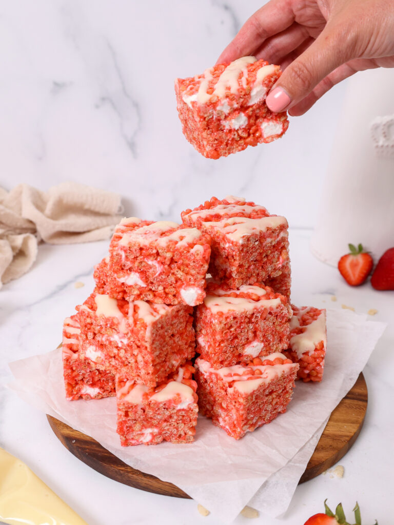 image of strawberry rice krispie treats being stacked in a pile