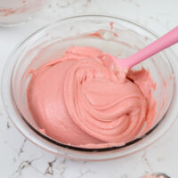 image of strawberry mousse cake filling that's been mixed together in a glass bowl