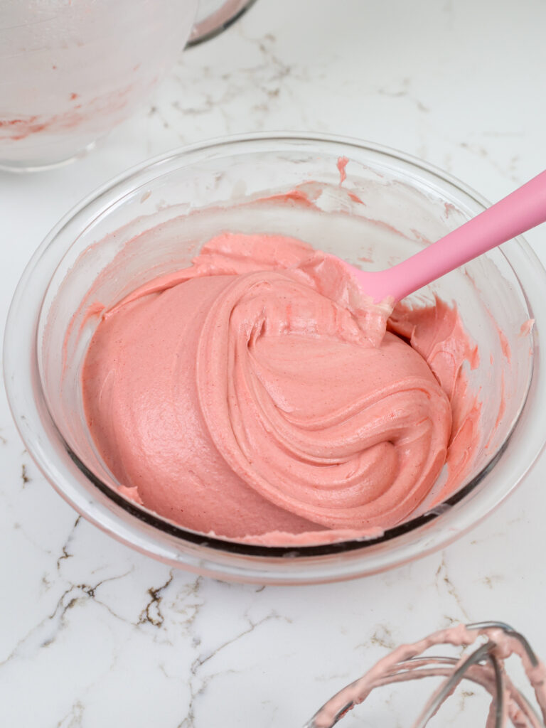 image of strawberry mousse being mixed together in a glass bowl
