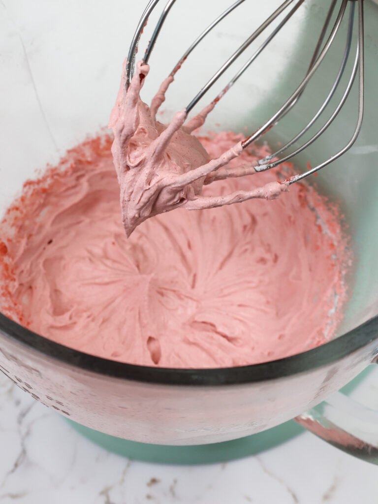 image of strawberry whipped cream that's been whipped until it reached stiff peaks