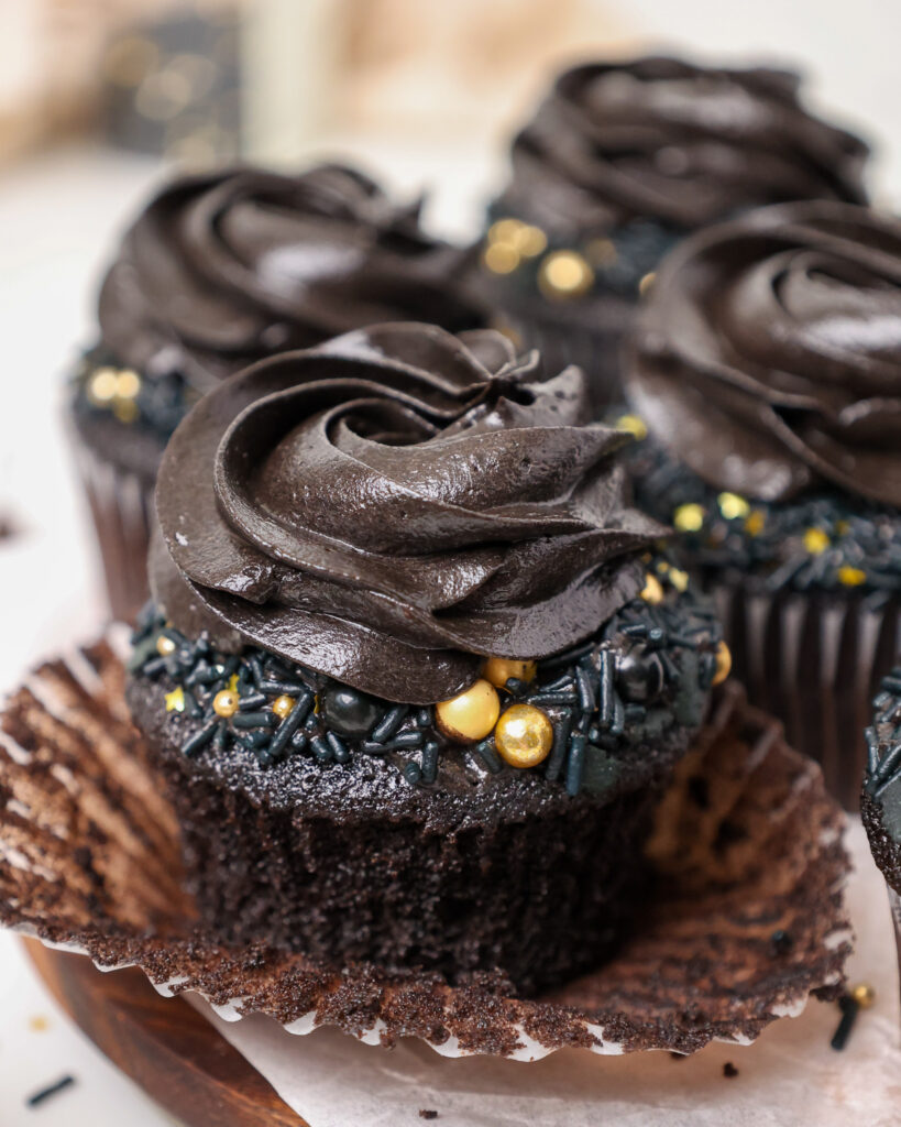 image of a black velvet cupcake that's been frosted with black cocoa buttercream