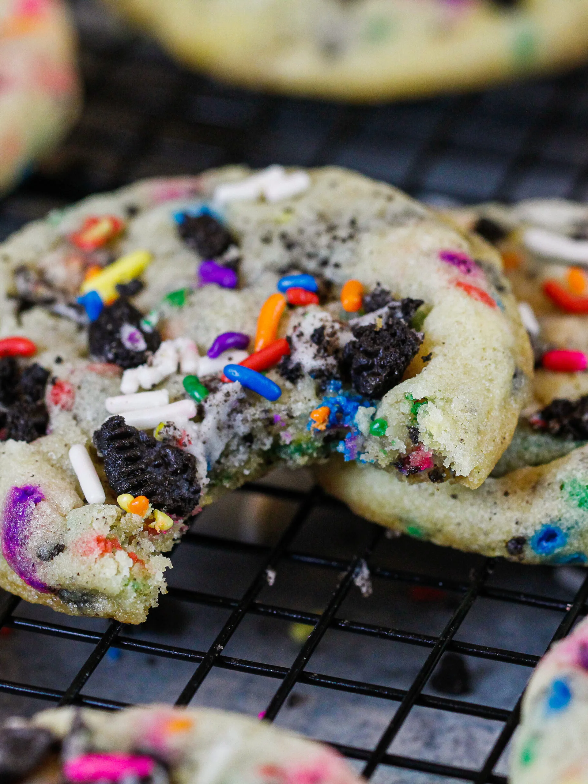 image of a funfetti oreo cookie that's been bitten into to show how soft it is