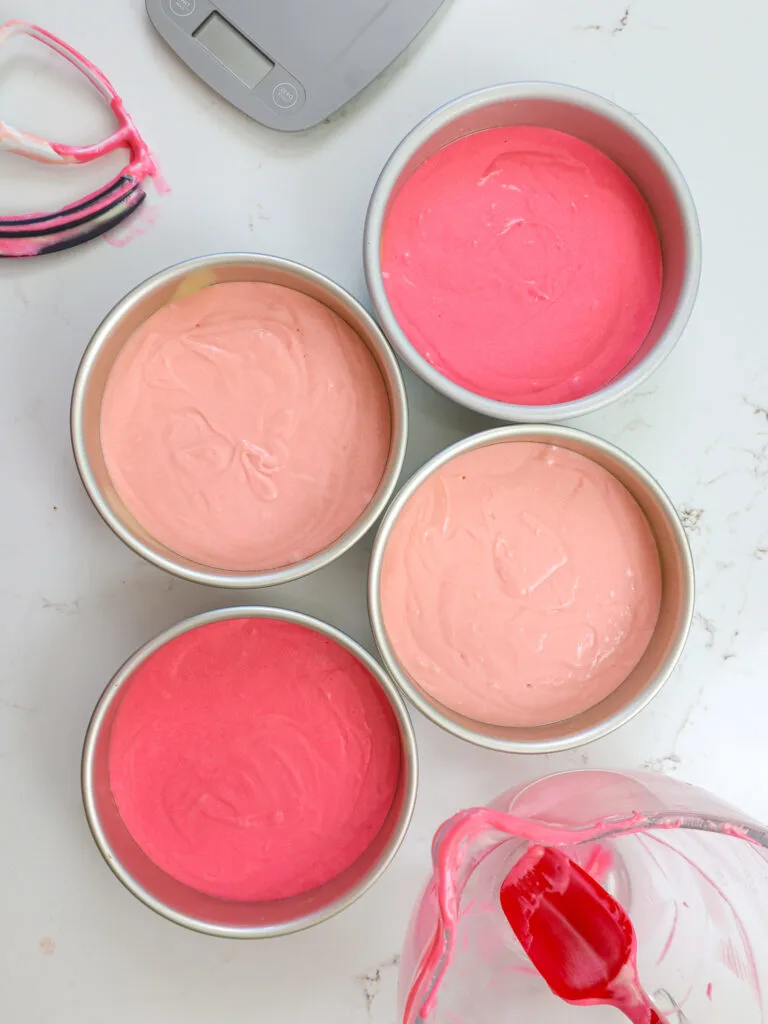 image of pink cake batter that's been poured into 7-inch cake pans 