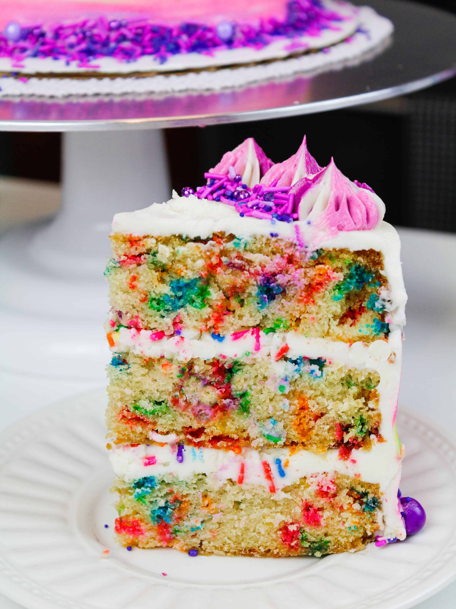 image of a slice of vegan funfetti cake
