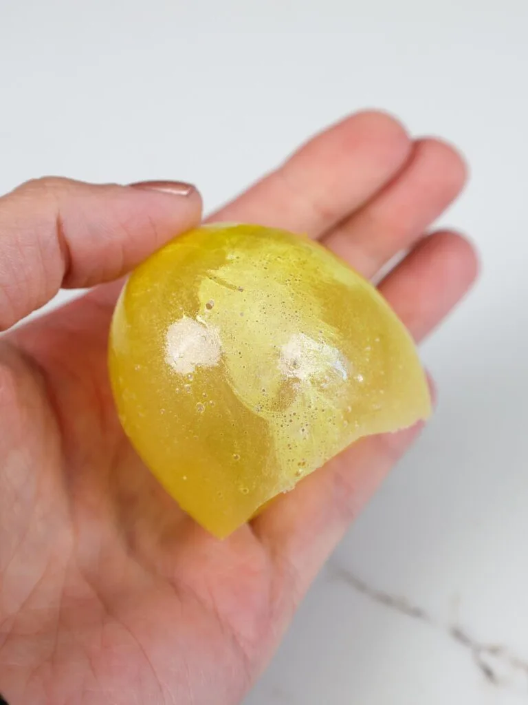 image of a gelatin balloon that was coated in too much shortening which caused white spots on the gelatin bubble once it dried