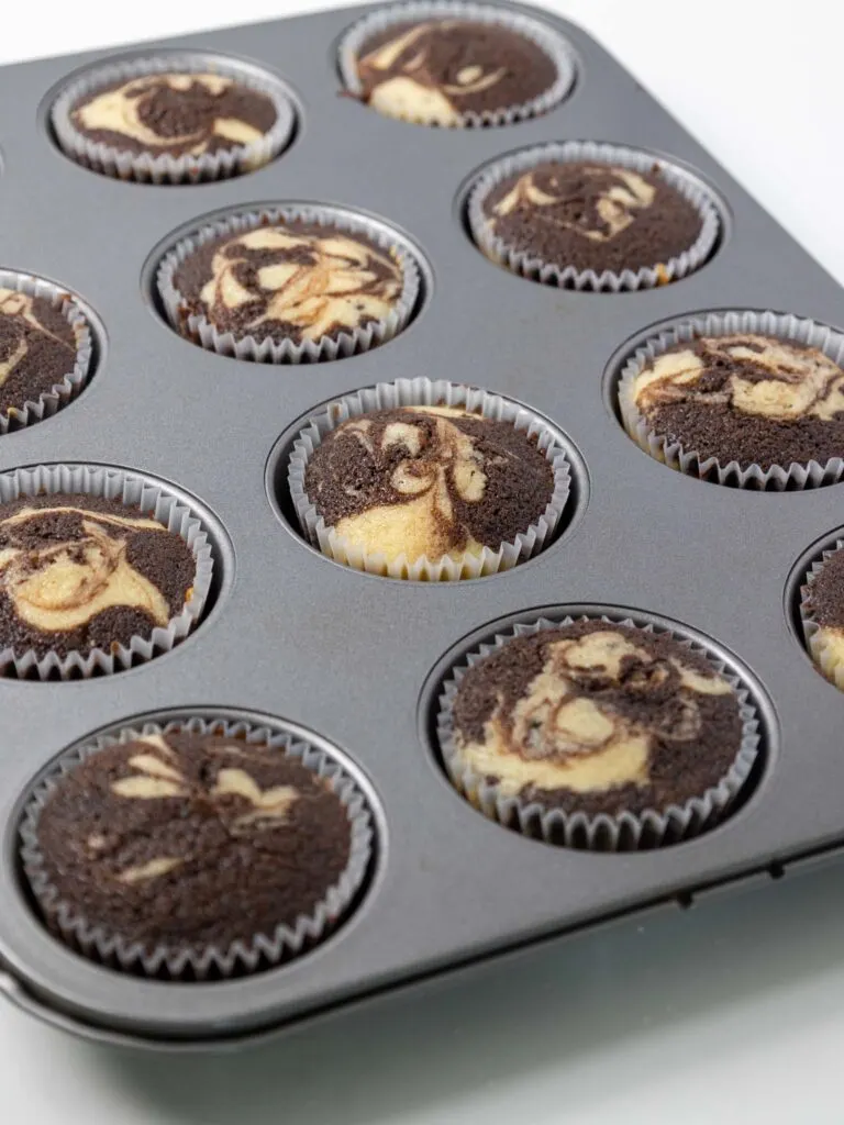 image of marble cupcakes that have been baked and are cooling in a baking pan