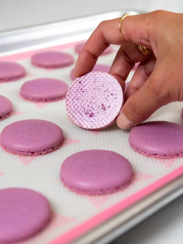 image of a properly baked french macaron shell that has a shiny, smooth bottom