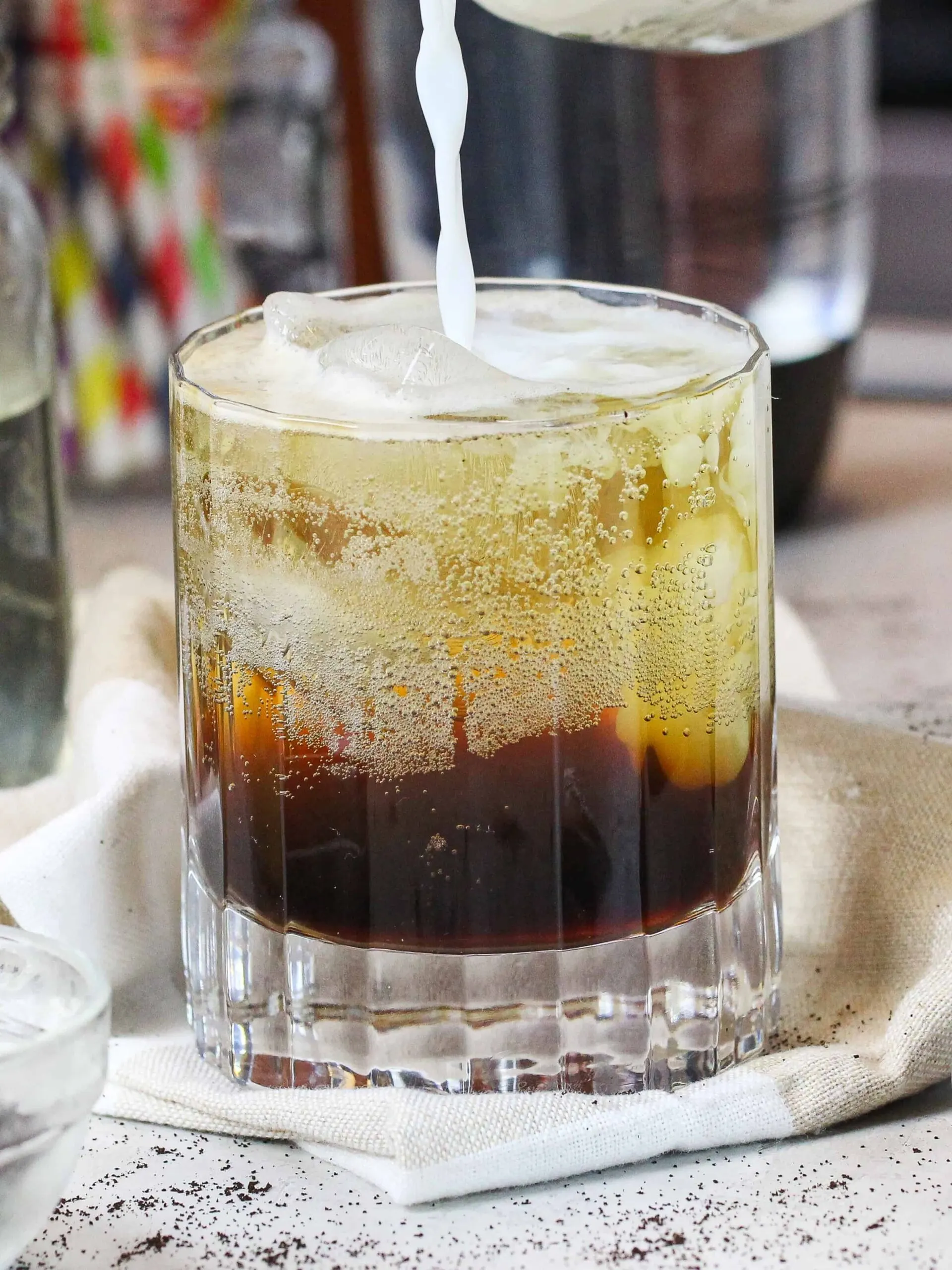 image of a splash of milk being poured into an espresso soda