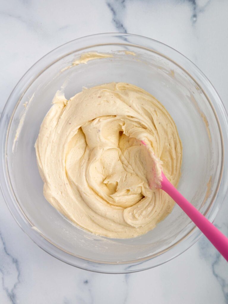 image of brown butter frosting that's been stirred with rubber spatula to make it super smooth