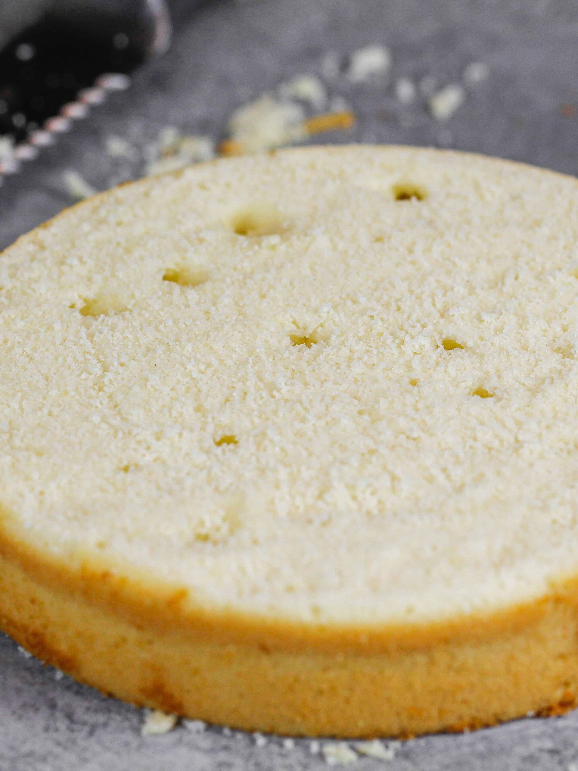 photo of a cake layer that was overmixed! This causes strong gluten strands to form which trap the leavening agent in the batter and cause it to create these air bubbles or tunnels.