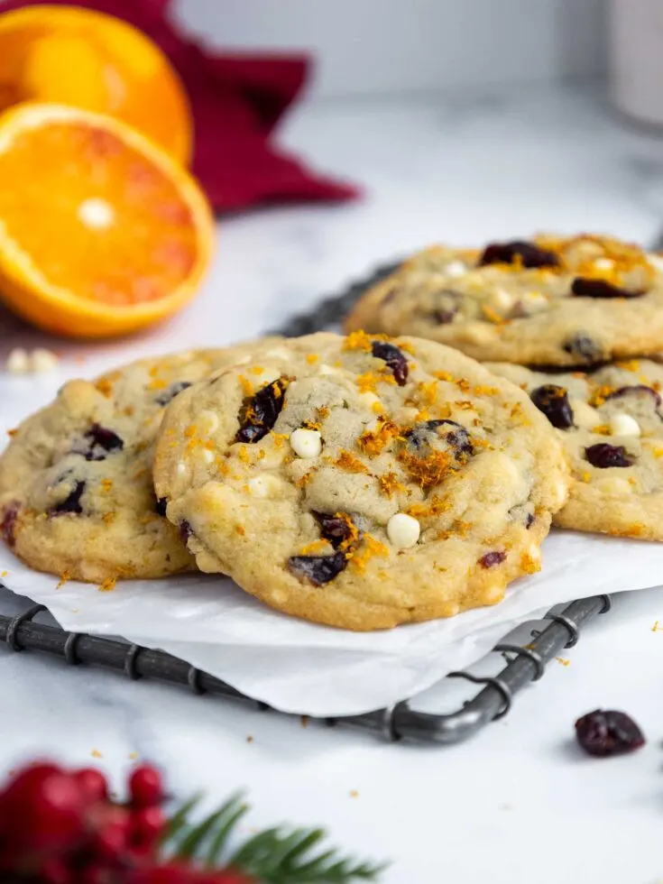 image of orange cranberry white chocolate cookies cooling on a wire rack