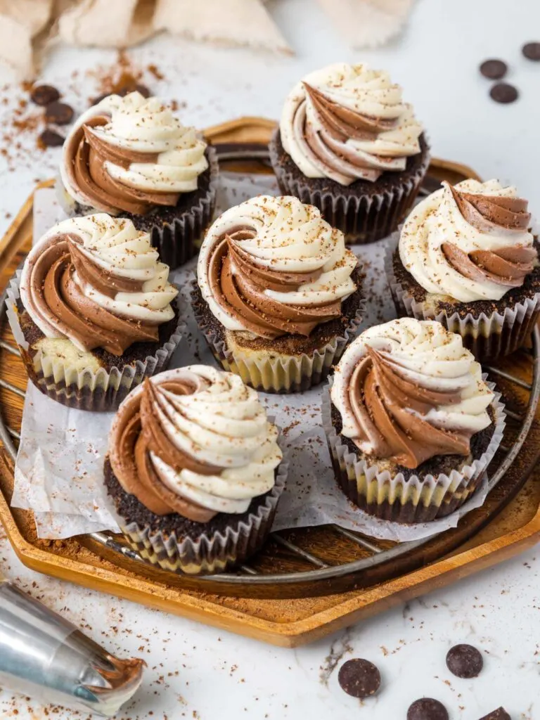 image of a moist marble cupcake that's been frosted with vanilla and chocolate buttercream