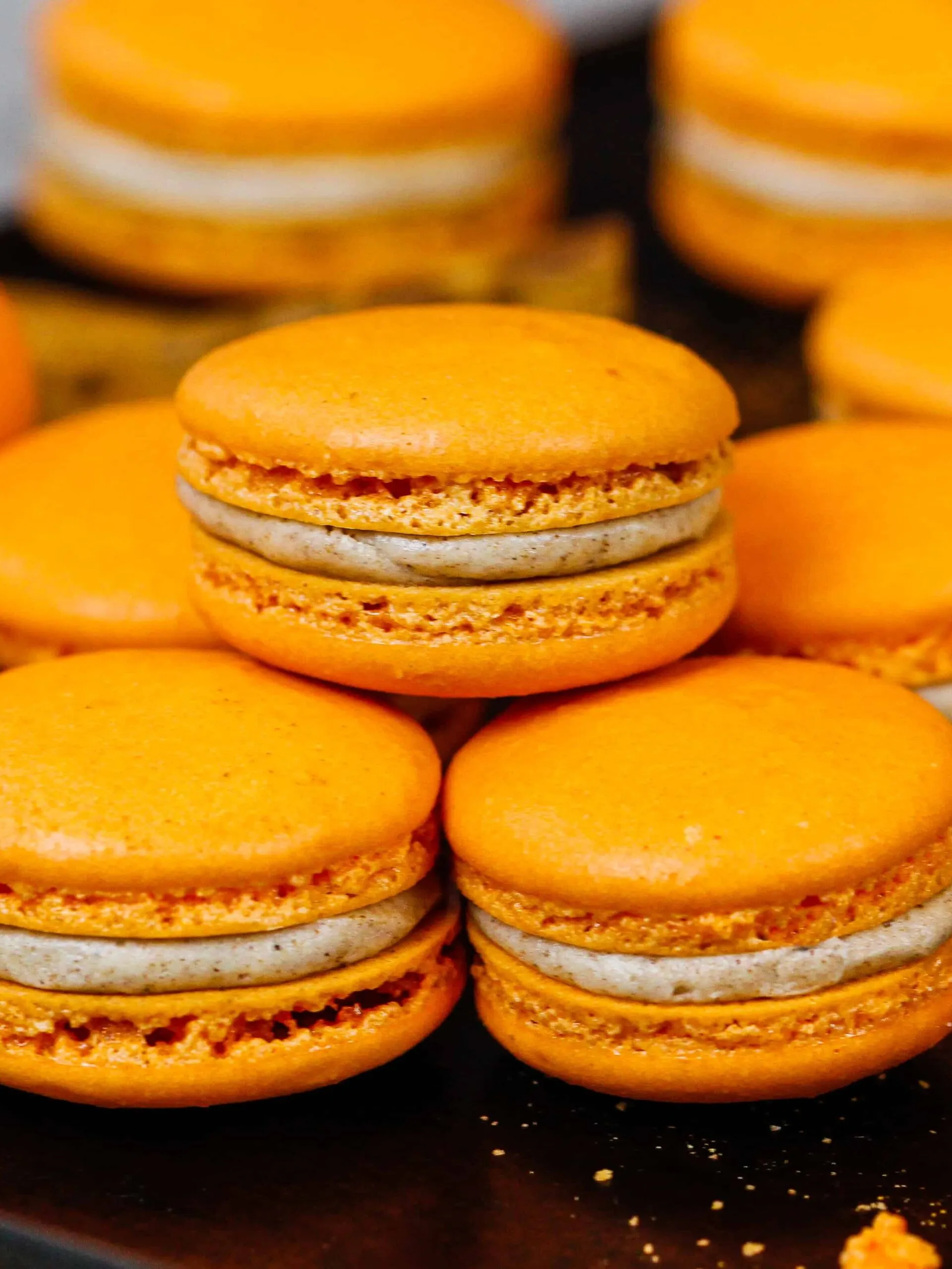 image of pumpkin macarons with a spiced buttercream and pumpkin pie filling