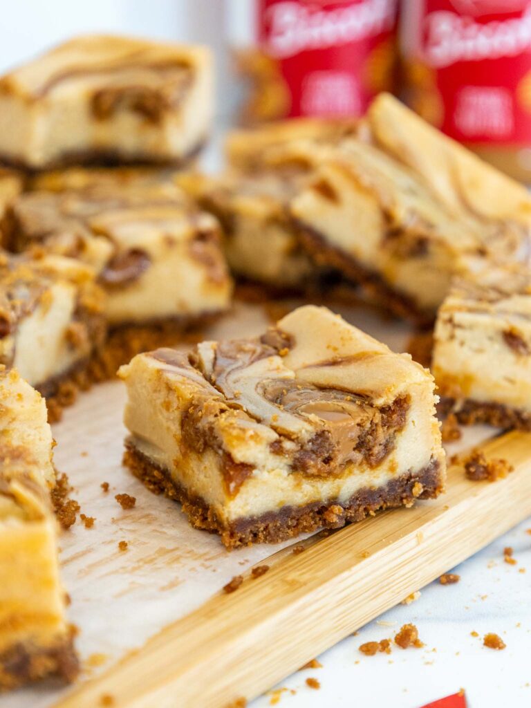 image of biscoff cheesecake bars cut up to show their biscoff cookie butter swirl