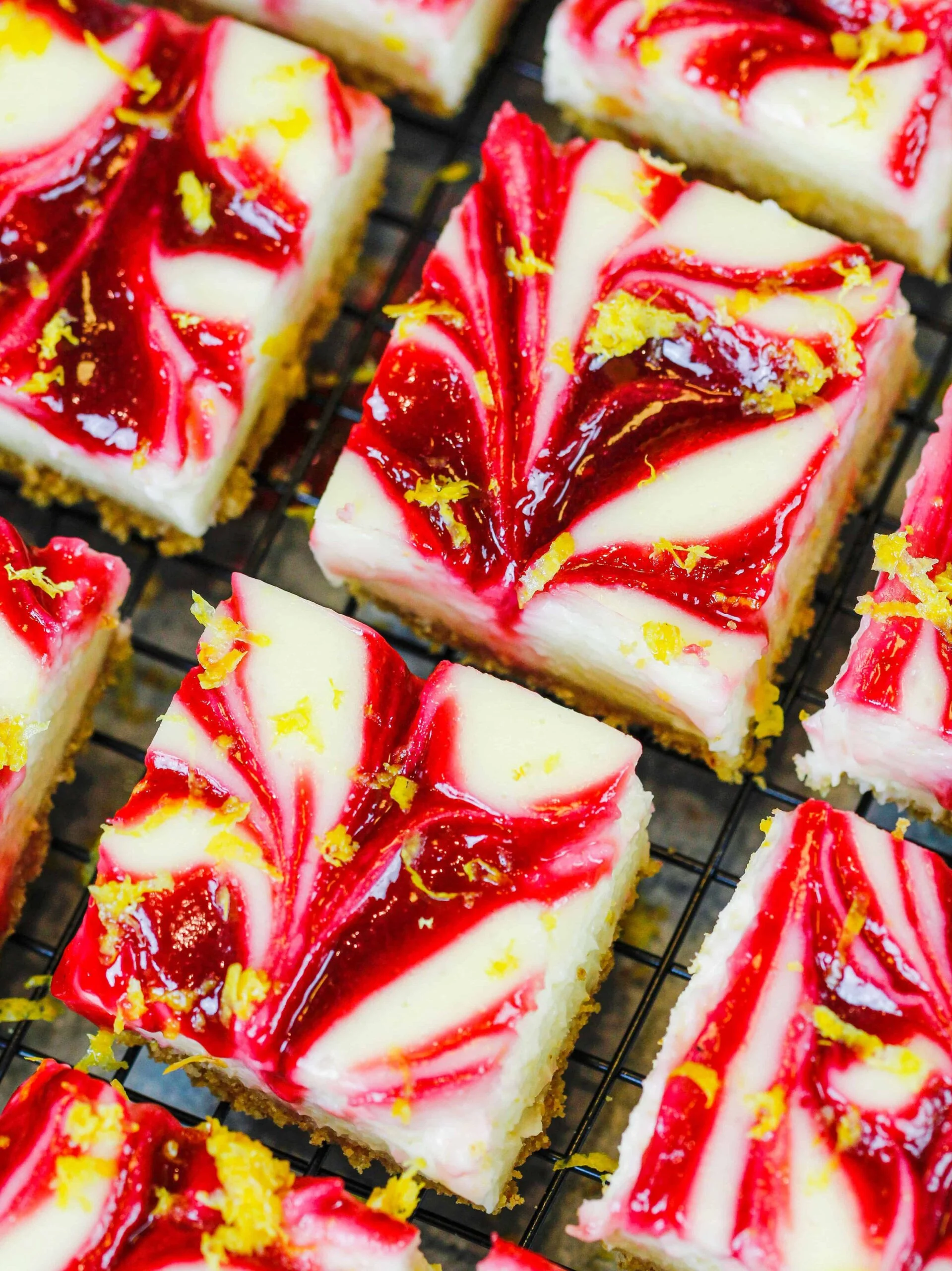 image of raspberry lemon cheesecake cut into squares
